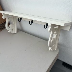 White decorative wooden shelf w hooks